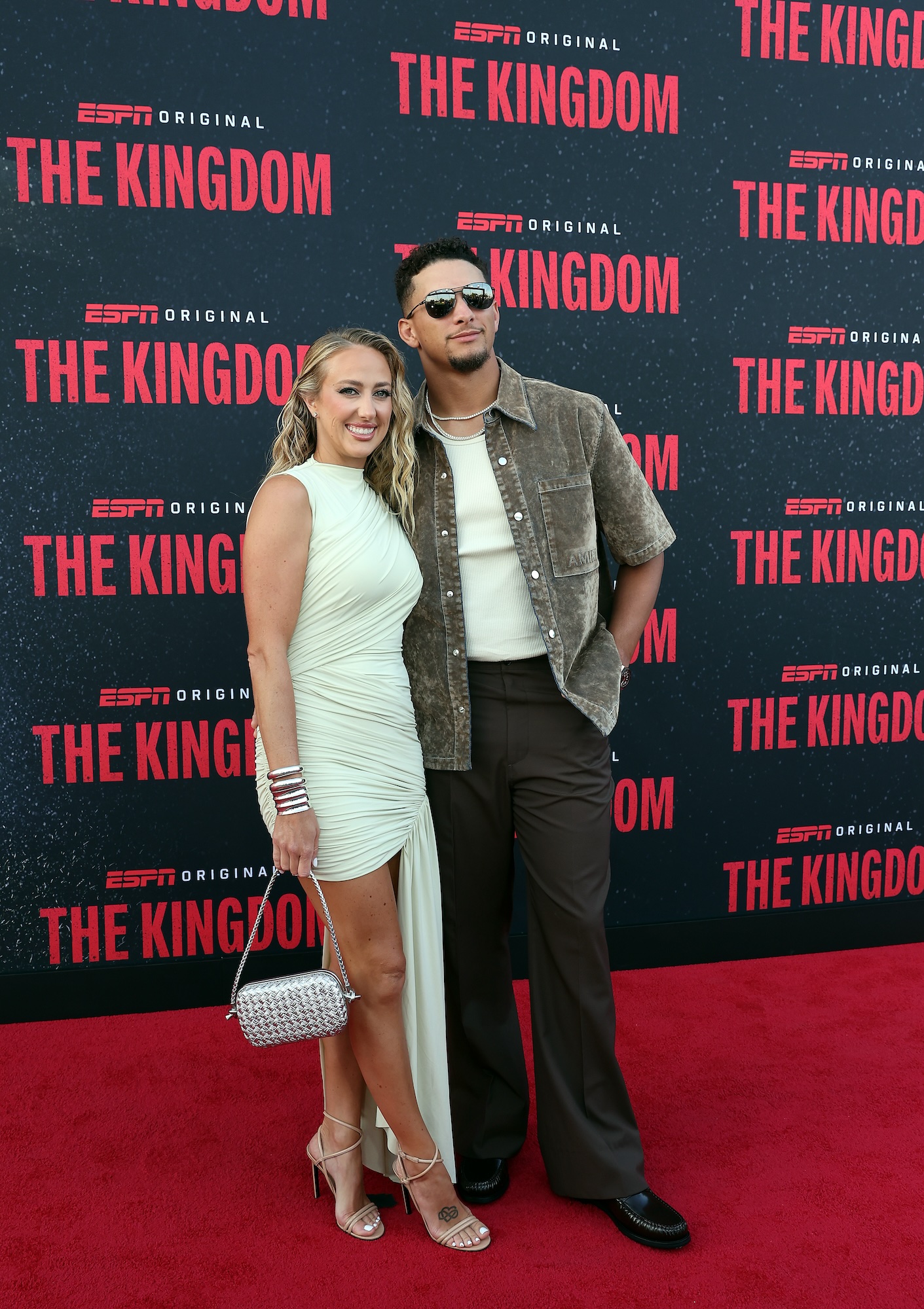 Brittany Mahomes Dazzles in Draped Dress While Supporting Husband Patrick at ‘The Kingdom’ Premiere