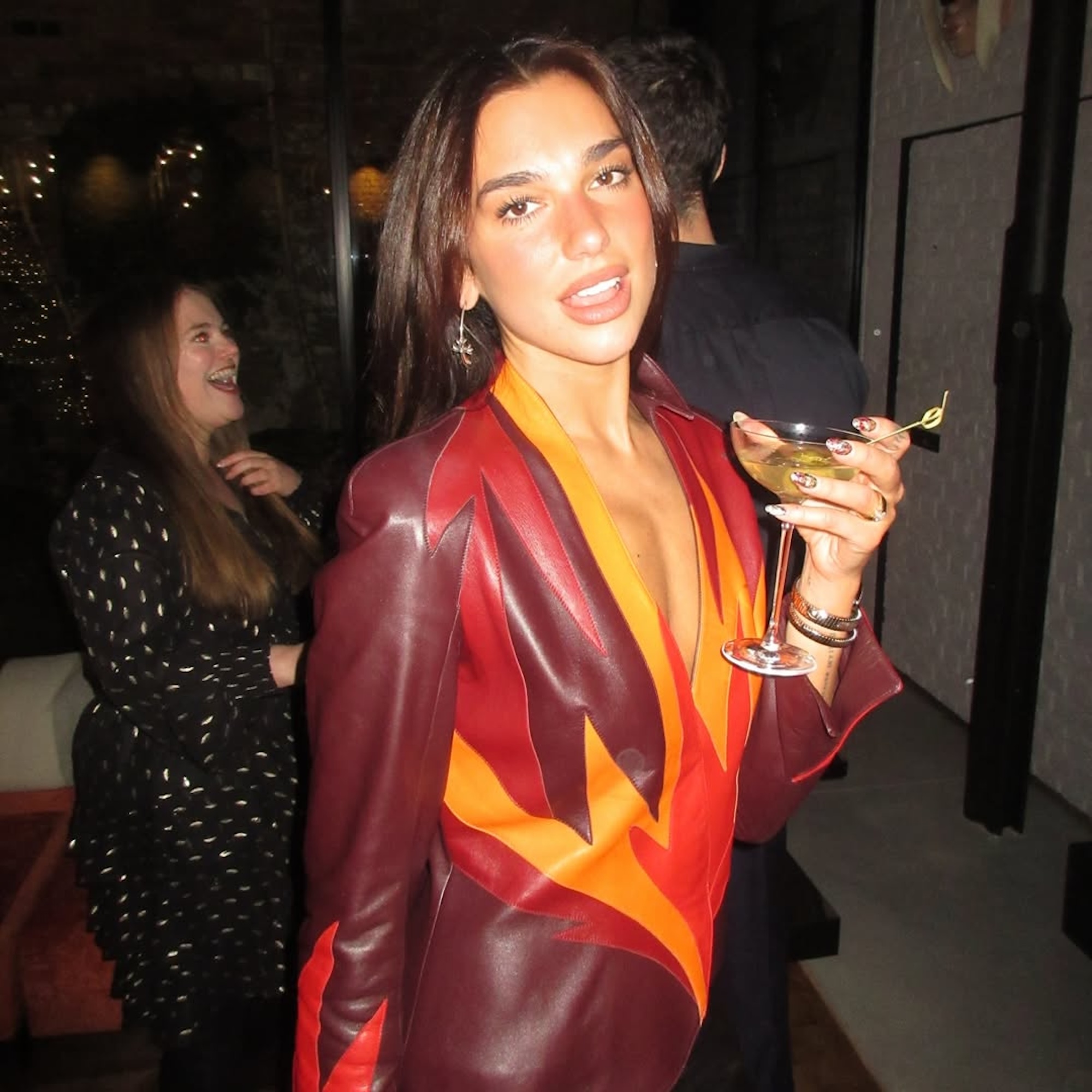 Dua Lipa Stuns in a Sheer Silver Naked Dress to Ring in 2026